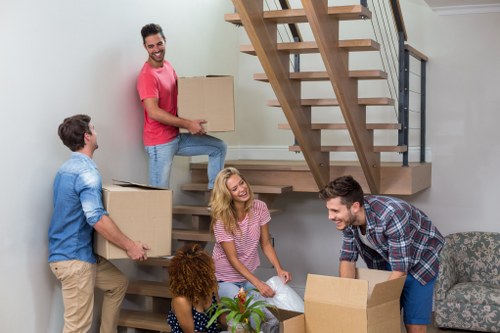 Removal team planning a move in Swiss Cottage with packed boxes