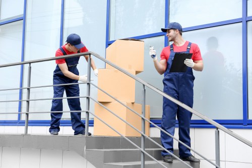 Loading commercial furniture for a business move near Swiss Cottage