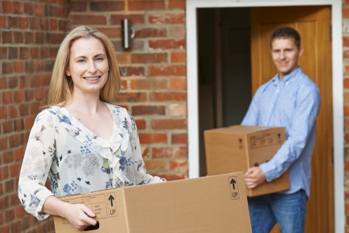 Moving staff using safety procedures during a Swiss Cottage removals job