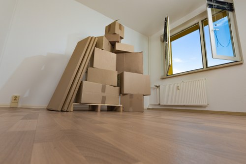 Student removals team loading boxes in Swiss Cottage outside a flat