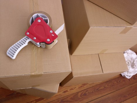 Professional movers handling boxes and furniture in Swiss Cottage