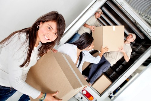 Local moving truck prepared for household relocation around Swiss Cottage