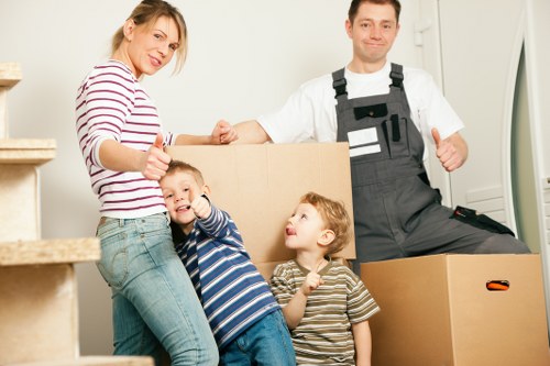 Preparation checklist and packed moving boxes in a London flat